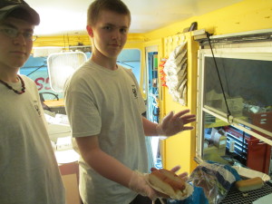 Jacob Marcus and Dylan Chagnon inside the Cape Cod Dawgs truck.