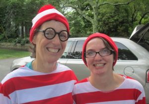 Vicky Titcomb and Ellie Tictomb promote an upcoming Where's Waldo scavenger hunt at Sandwich retail shops.