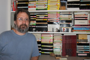 Brad Moore with his collection of early films.