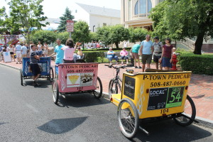 P-town Pedicabs lined up in front of Provincetown Town Hall waiting for fares.