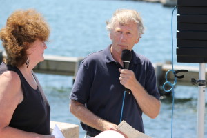 Eric Turkington and Susan Shephard, co-chairs of the Statue Committee, make introductions at the dedication ceremony in Woods Hole.