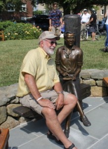 Sculptor David Lewis of Osterville poses with his statue of Rachel Carson.