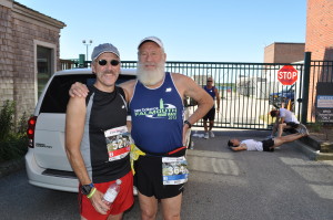 Tom Dann, who ran his 25th Falmouth Road Race today, poses with Brian Salzberg, one of the Falmouth Five who have run in every Falmouth Road Race, just before the start of the 41st New Balance Falmouth Road Race.