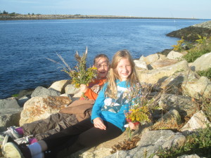 Bridget Brochu and Nerys Nelson, both 9, of Dennis, relax in their newly-discovered "rock chair" along the Cape Cod Canal.