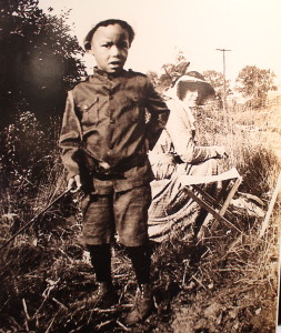 A photo from artist Blanche Lazzell's collection shows Edith Lake Wilkinson about to paint a young boy's portrait in Provincetown. The photo was on display at Larkin Gallery where a one-woman show of Wilkinson's work is being shown.