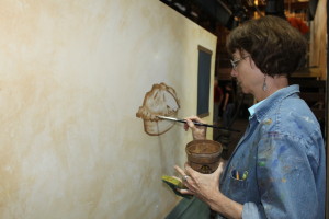 Nancy Bundy draws a cherry pie for the storefront of Mrs. Lovett's meat pie shop.