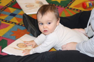 Max, at almost nine months old, is learning to love books at an early age.