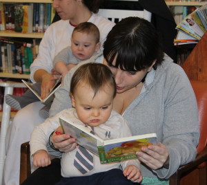 Jodi and her son Max participate in an early reading program at Cotuit Library.