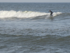 Ryan Garcia of Wellfleet catches a January wave at Marconi Beach.