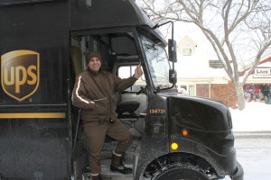 Dana Phares is all smiles while working the blizzard shift for UPS on Falmouth's Main Street.