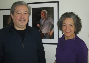 John Economos and Maxine Smith - The Econosmiths in front of one of their photos of the legendary Pete Seeger.