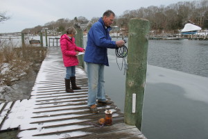 Doc Taylor and Mimi Gregory, volunteers in the Pond Watch program, take samples at Child's River in Waquoit in Falmouth.