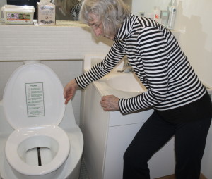 Hilda Maingay shows off one of the three eco-toilets in her Falmouth home.