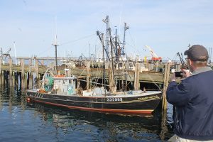 Dunlap takes a photo of one of the last Eastern-rigged fishing boats in the Provincetown fleet.