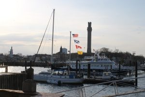 The skyline of Provincetown from Macmillan Pier with the Provincetown Monument rising up in the background.