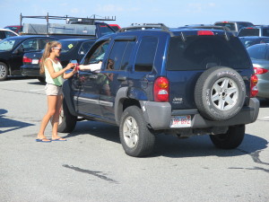 Molly O'Brien greets someone wanting to park at Old Silver Beach.