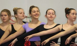 Celia Grace Lacey, center in purple leotard, during a recent rehearsal.