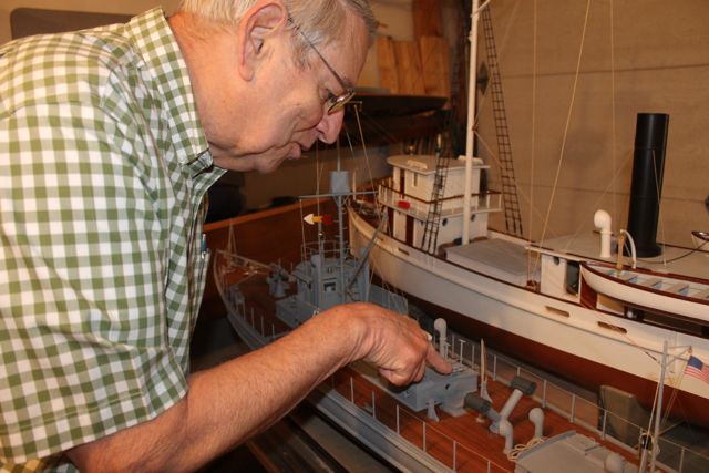 Pete Beckloff points out details in the World War I-era sub chaser he built at 1/24 the size of the original.
