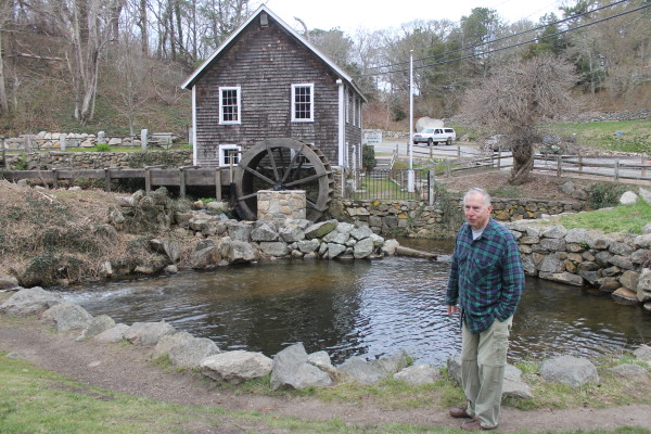Elliott Carr in front of the Stony Brook Grist Mill.