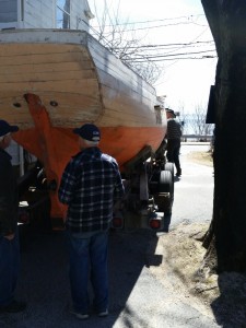 COURTESY KURT UETZ Some of the boat shop guys at the Woods Hole Historical Museum survey the Sultana as it arrives on the museum property earlier this spring.