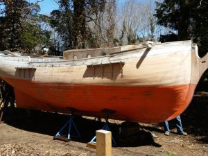 COURTESY KURT UETZ Finishing the Sultana, a half-model of an 18th century schooner, is the next project for the boat shop guys at the Woods Hole Historical Museum.