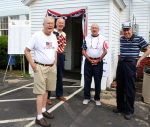 Several Strawberry Festival volunteers stand outside as the final preparations take place. From left, Jim Heatley, Allan Brier, Dennnis Marquis and Al Clough.