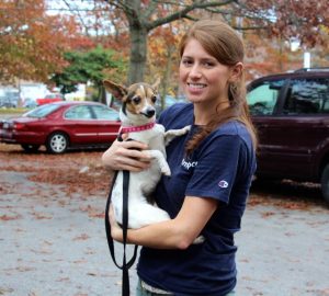 Volunteer Brittany Pickul holds Peanut, a 15-year-old Jack Russell terrier who recently got his teeth cleaned.