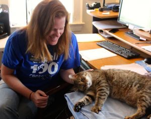 MSPCA--Cape Cod Program Coordinator Clare Edmonds gives some love to Tigger in the agency's office.