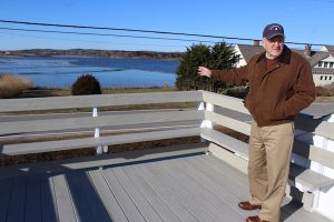 Kevin Doyle shows a view of Salt Pond from the deck of his home on Mill Road.