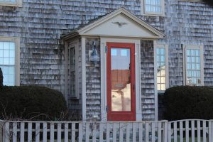 One of the oldest homes on Shore Street is distinguished by its red door.