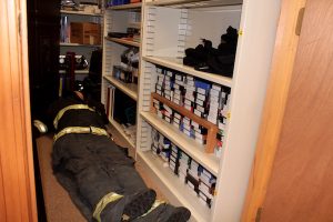 Overcrowding extends to a closet that doubles as a training library, complete with a "dummy" that takes up the floor space.