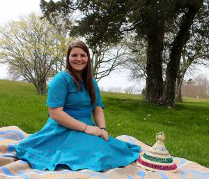 Kara Howard is back home on Cape Cod after serving for two-and-a-half years in the Peace Corps in Lesotho. She wears a traditional dress given to her by her Lesotho family.