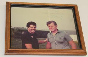 PHOTO COURTESY CHIEF BRUNELLE As a young firefighter, Chief Brunelle got to know Senator Ted Kennedy and the two stayed friends for decades. This photo hangs on his wall.