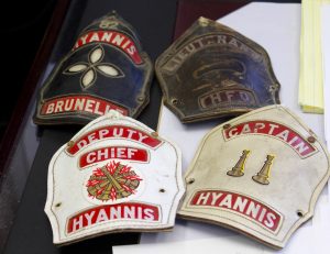 CAPE COD WAVE PHOTO Chief Brunelle's badges tell the story of his rise in the ranks of the fire department.