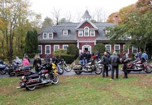 Motorcycles parked across the lawn at the Carriage House shelter in North Falmouth.