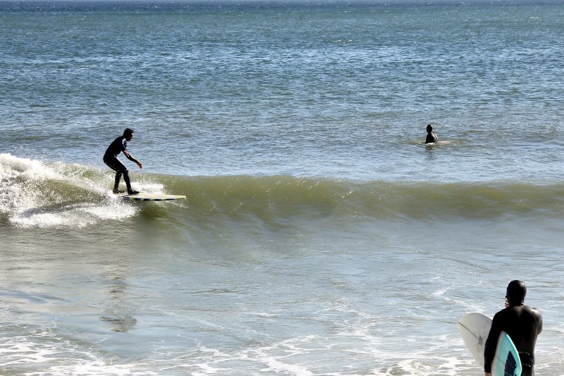 Lecount Hollow Beach surfers