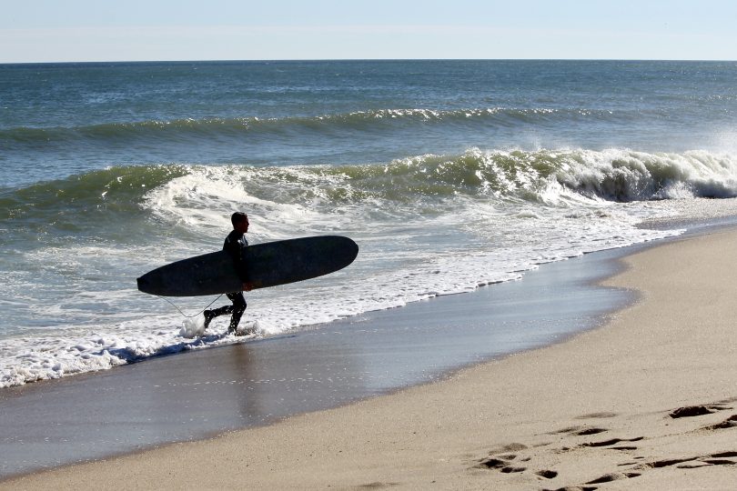 Lecount Hollow Beach surfers