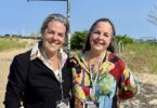 Jackie Reeves and Lauren Wolk in front of the iconic "Art" sign in Provincetown.